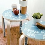 Perk up a plain table or stool with salvaged wallpaper scraps.