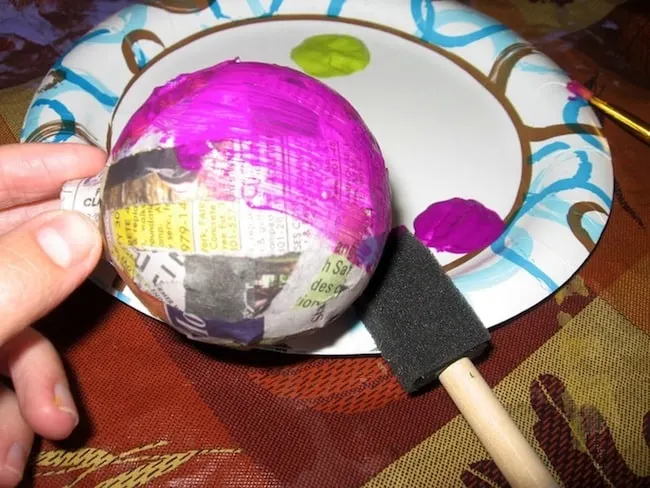 In this budget friendly, recycled Halloween craft, you'll use Mod Podge and old Christmas ornaments to make these cool Halloween ornaments!