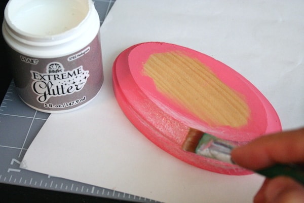 Painting the edge of the painted plaques with Extreme Glitter