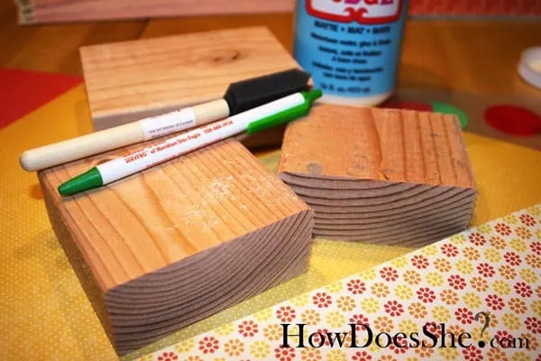 Leave sweet messages for your family with this love note Valentine's Day decor, built with scrap wood and decorated with pretty papers and Mod Podge.