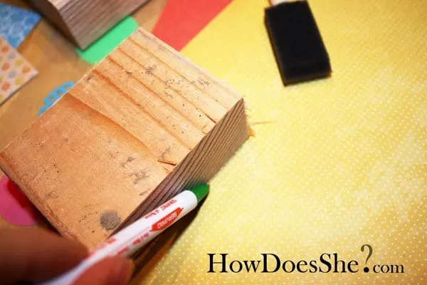 Leave sweet messages for your family with this love note Valentine's Day decor, built with scrap wood and decorated with pretty papers and Mod Podge.