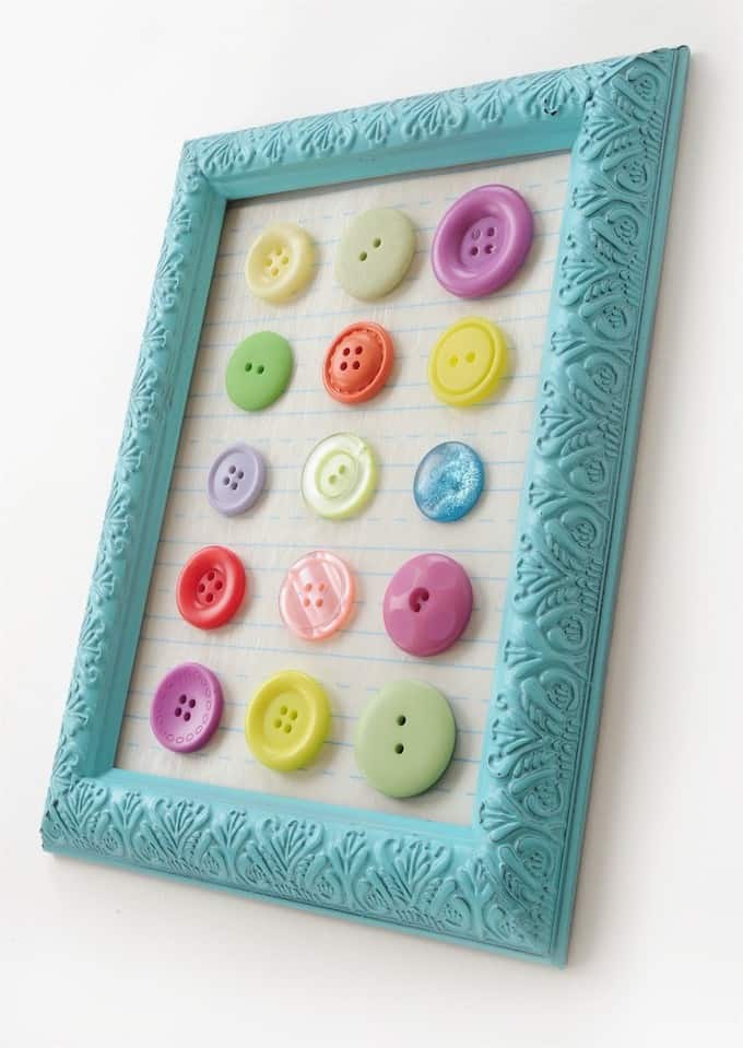 If you are looking for cheap DIY wall decor with a pop of color, you'll love this EASY button art! I created it using a dollar store frame.