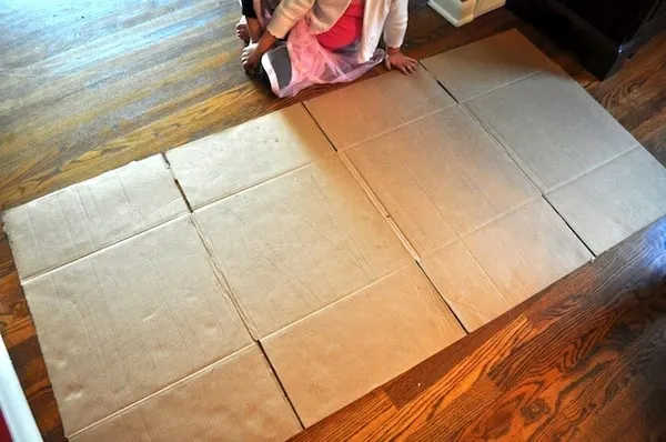 Cardboard box spread out on the floor