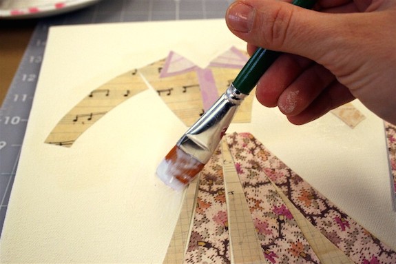 Adding Mod Podge over the top of the scrapbook paper dress design