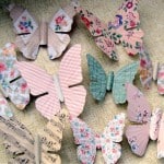 Turn antique metal butterflies into pretty magnets with wallpaper and Mod Podge. Use these easy butterfly decorations in your home decor!