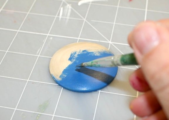Painting a wood pendant with blue paint