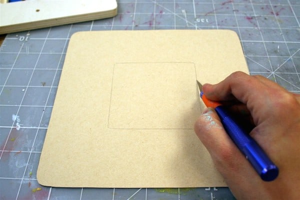 Cutting scrapbook paper with a craft knife