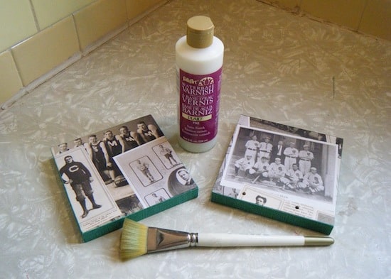 Wood bookend pieces laid out with a bottle of varnish and a paintbrush