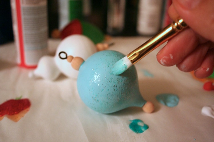 Painting a wood ornament with glitter paint