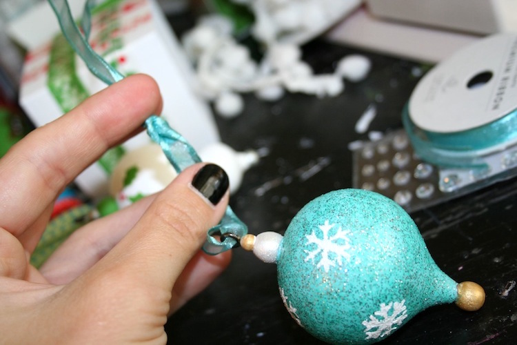 Adding a ribbon to a DIY Christmas ornament