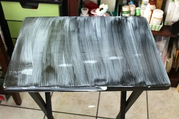 Coat of Mod Podge applied to the top of the TV tray