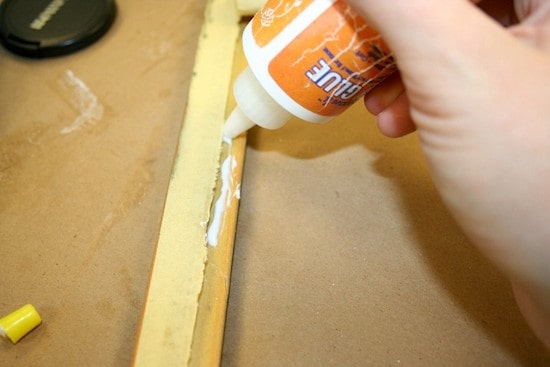 Adding craft glue to the edge of a frame