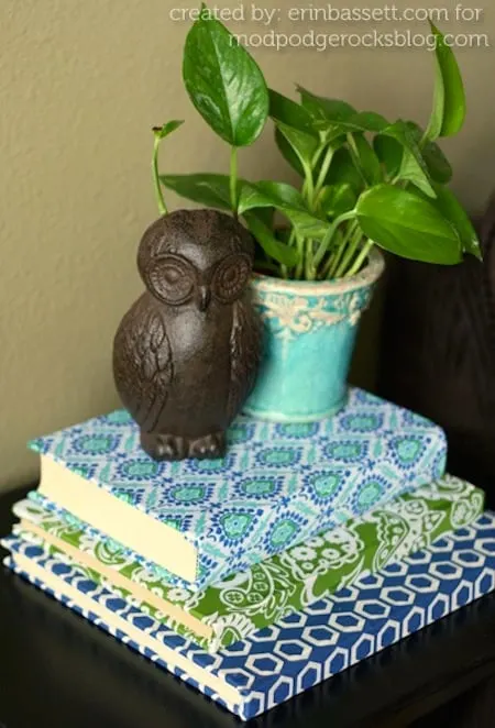 These fabric covered books make the perfect home decor pieces - and they are so cheap to make. Use old books, your fave fabric and Mod Podge to make.