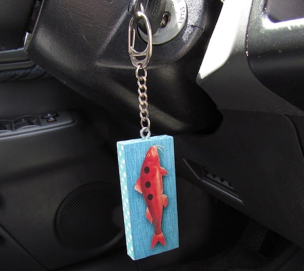 DIY keychain hanging from a key in a car ignition