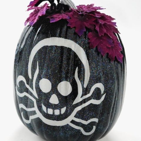 Make a painted pumpkin with a skeleton design. This Halloween craft is SO easy - add Sparkle Mod Podge for a really festive touch!