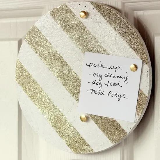 Use glitter and Mod Podge to turn IKEA trivets into DIY cork boards! Customize with the glitter and paint colors of your choice.