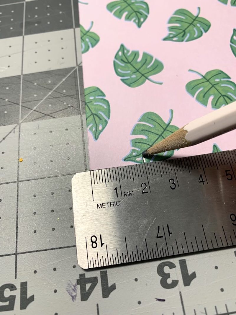 Measure and cut scrapbook paper