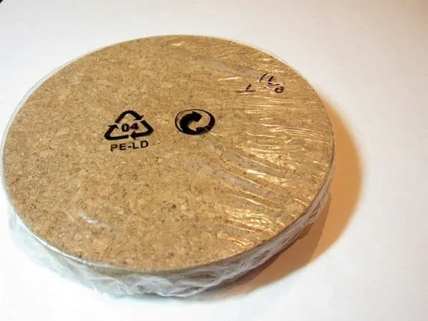 Use glitter and Mod Podge to turn IKEA trivets into DIY cork boards! Customize with the glitter and paint colors of your choice.