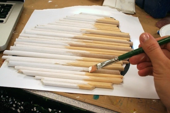 Painting dowel rods with white acrylic paint