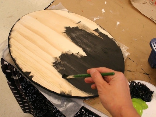 Painting the plaque edges and back with black acrylic paint