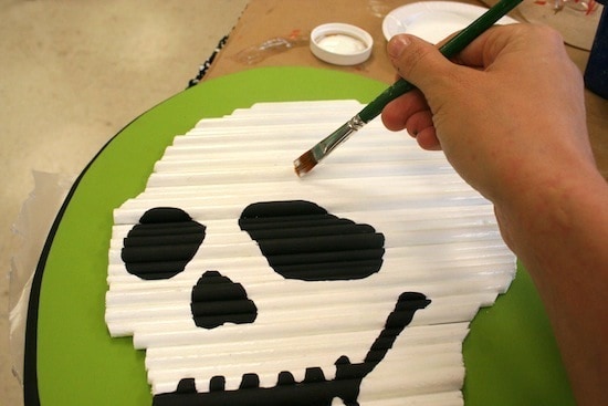 Painting Mod Podge Glow in the Dark on top of the skeleton