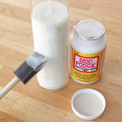 In this cute winter craft, you'll use Mod Podge and dollar store supplies to decorate snowflake votives. So easy and inexpensive!