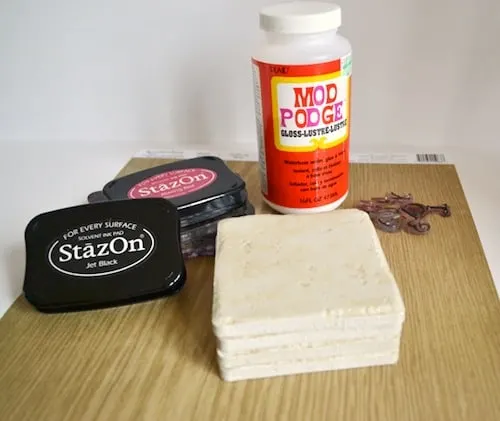 Stone tiles, Mod Podge, Stamp pads, scrapbook paper, and stamps