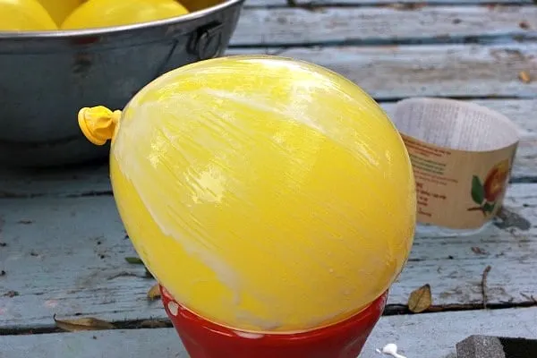yellow balloon covered with Mod Podge