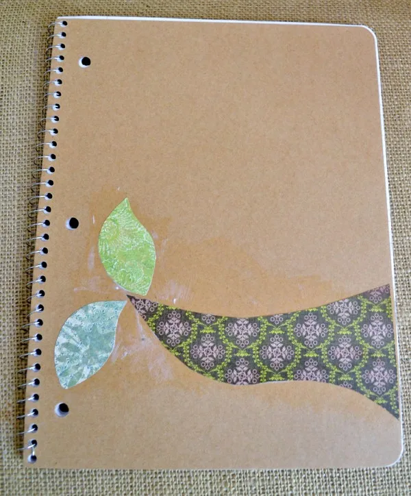 Scrapbook paper decoupaged onto the cover of a notebook