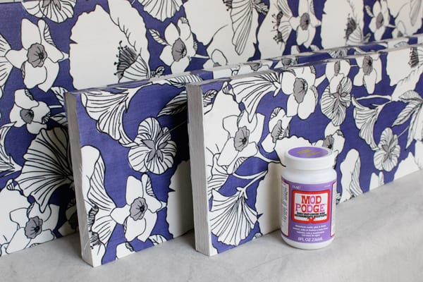 How To Decoupage Fabric Onto Shelves Mod Podge Rocks