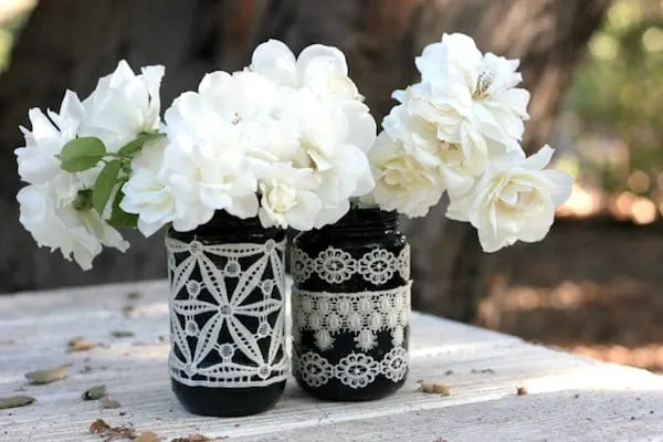 Mason jar decor with lace and flowers