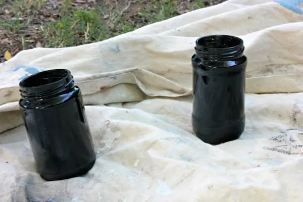 Glass jars spray painted with black spray paint