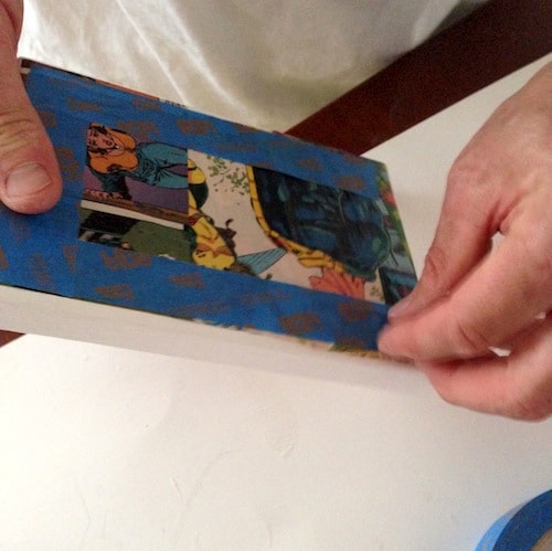 Using blue painter's tape around the edge of a canvas
