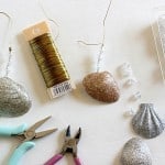 Make holiday decorations the easy way! This seashell ornaments DIY is so simple . . just use glitter and Mod Podge to make pretty Christmas decor.