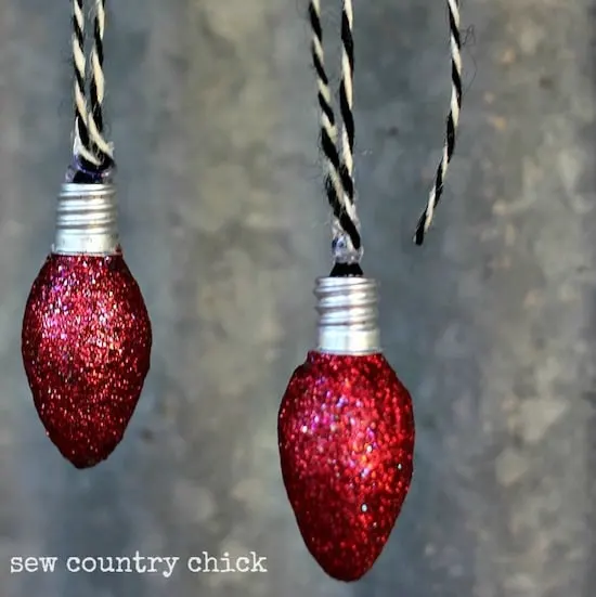 Don't throw away burned out night light bulbs - turn them into light bulb Christmas ornaments with Mod Podge and glitter!