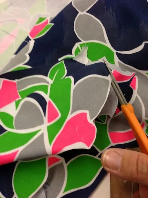 Cutting a flower design out of fabric
