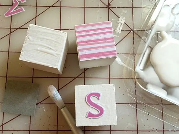 Making DIY wooden abc blocks with Mod Podge and scrapbook paper