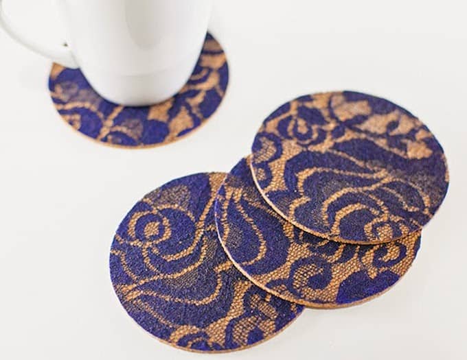 Scraps of lace can make a cool effect on the surface of these easy decoupage DIY coasters. Learn how to make them in a few easy steps.