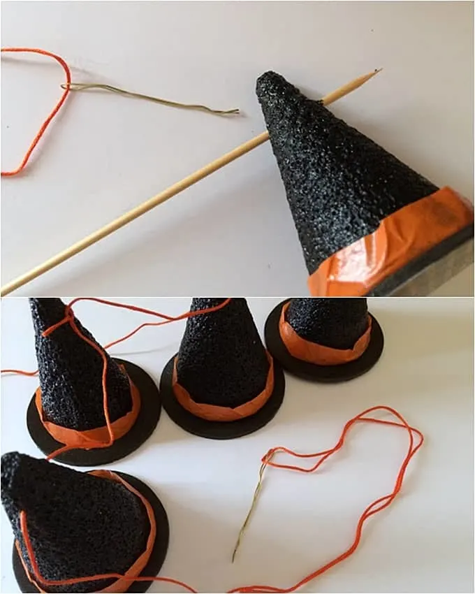 Making holes through the tops of the foam cones with a BBQ skewer and stringing them up