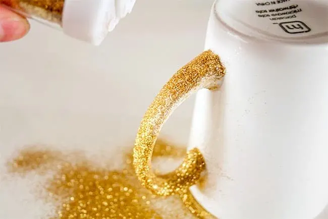 You can make this DIY glitter mug with Dishwasher Safe Mod Podge - then you can safely wash it without any glitter coming off!