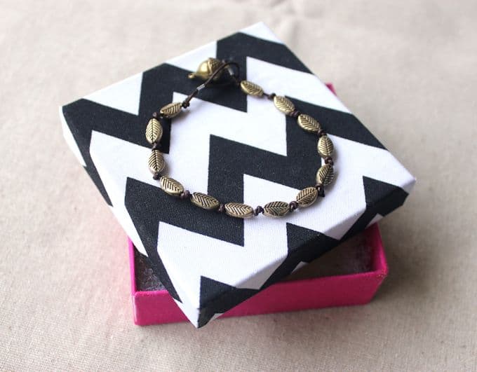 DIY gift box with a handmade bracelet on top
