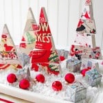 DIY Christmas tree centerpiece with faux snow, ornaments, and small packages