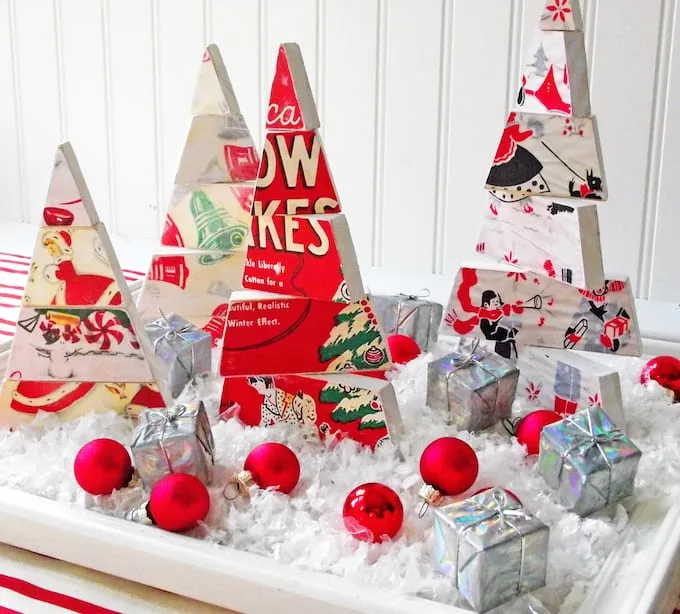 DIY Christmas tree centerpiece with faux snow, ornaments, and small packages