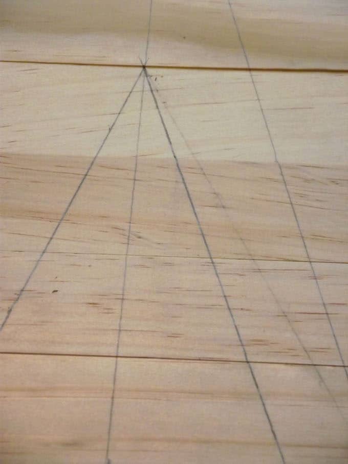 Triangles drawn onto craft wood slats