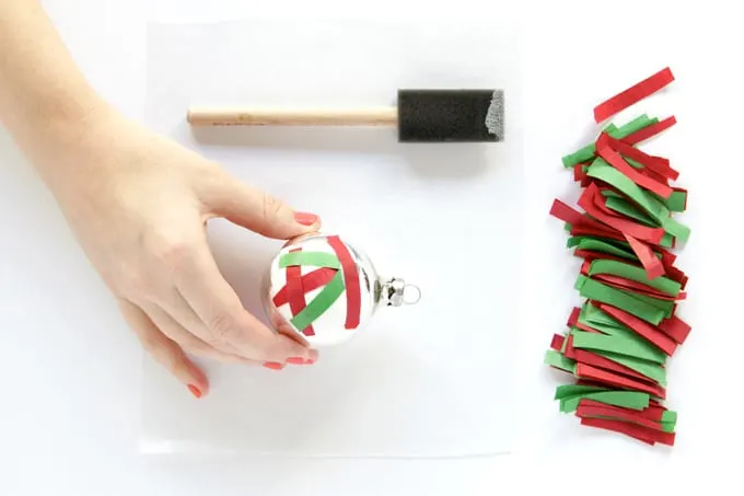 Add tissue paper confetti to the ornament base with Mod Podge
