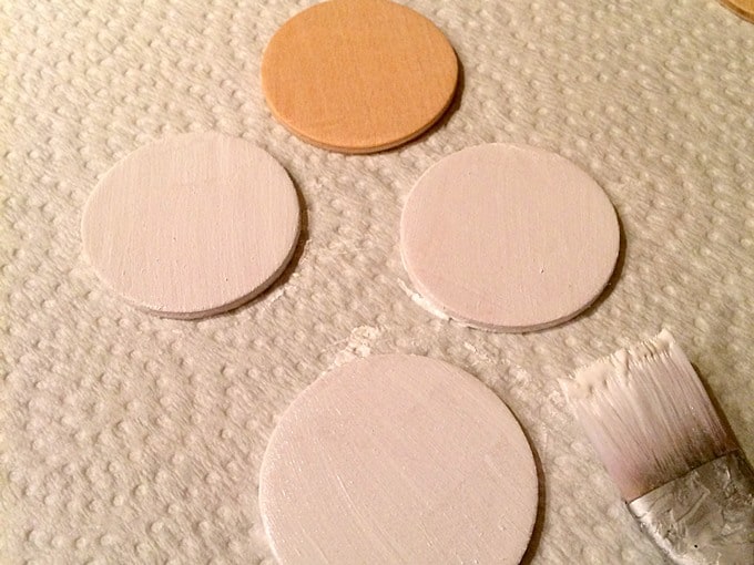 Painting wood circles with white acrylic paint