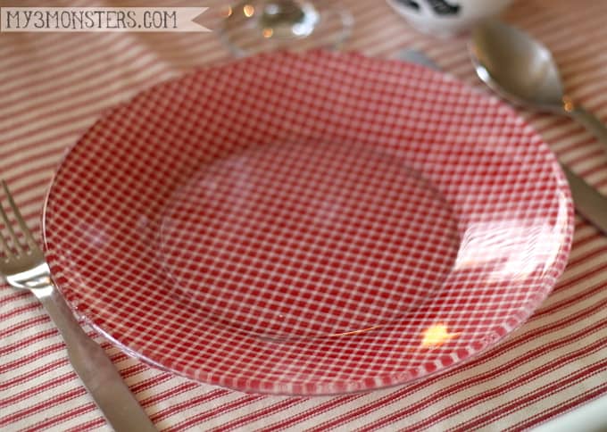 Create these unique decoupage plates for your next celebration using clear glass plates from the dollar store, fabric, and Mod Podge.