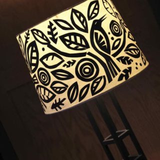 This Mod Podge lamp shade is an easy-to-do decoupage project involving cut black paper and your favorite shapes. Get the tutorial here!