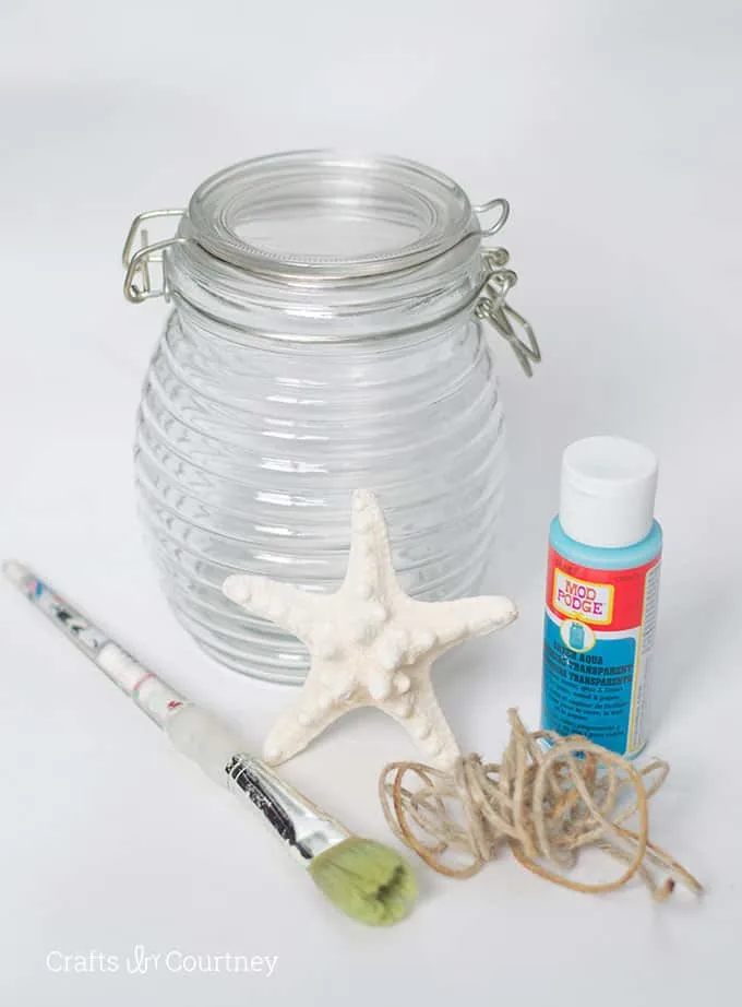 Glass jar, Mod Podge, paintbrush, twine, and a starfish