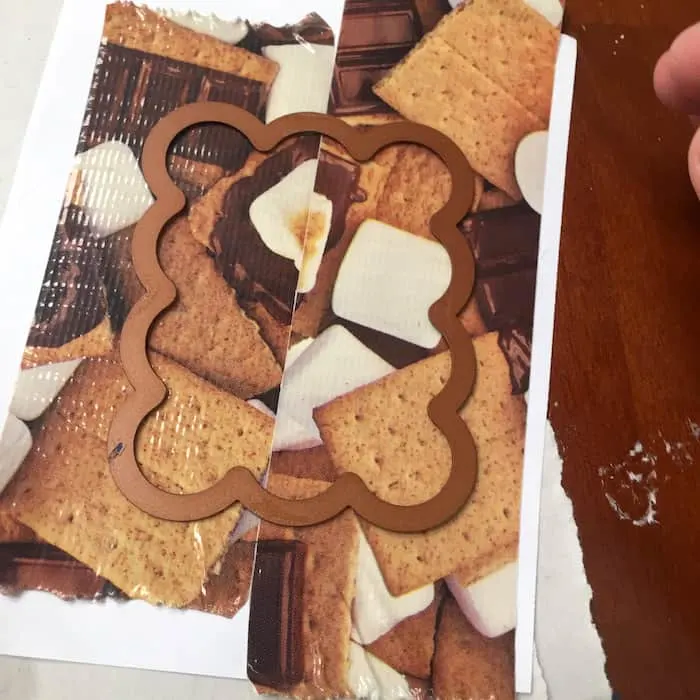 Die cut placed on top of Duck Tape on paper